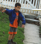 Christopher Launches a Frisbee